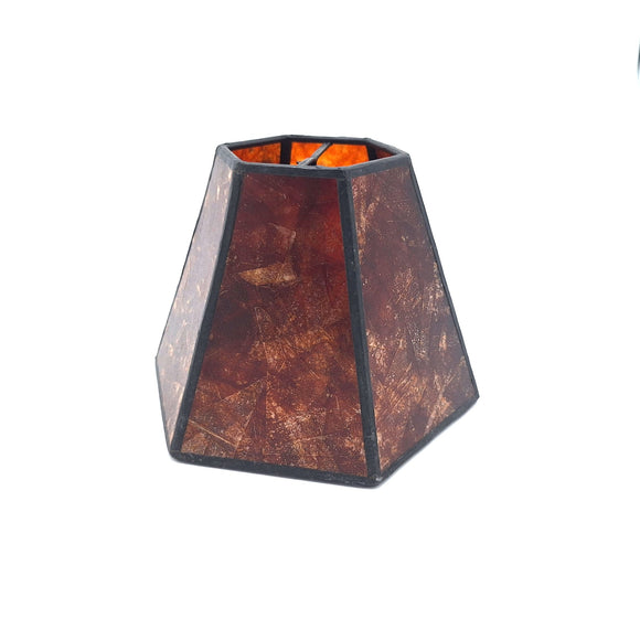An amber mica chandelier hexagonal lampshade shown at a slight angle, highlighting its warm translucent natural stone panels.
