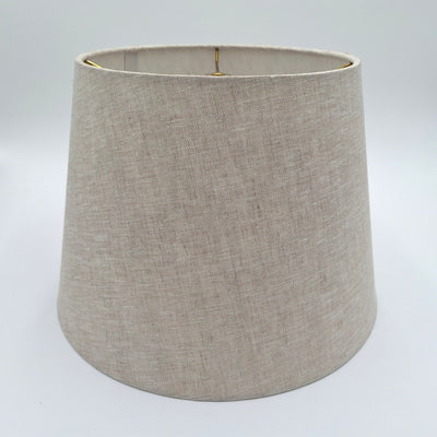 A natural linen British Empire lampshade with rolled edges and translucent finish, shown against a plain white background.