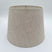 A natural linen British Empire lampshade with rolled edges and translucent finish, shown against a plain white background.