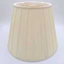 A beige pongee space box pleat empire lampshade shown at a slight angle, highlighting the distinctive spaced pleat design.