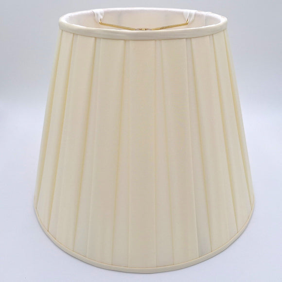 A beige pongee space box pleat empire lampshade shown at a slight angle, highlighting the distinctive spaced pleat design.
