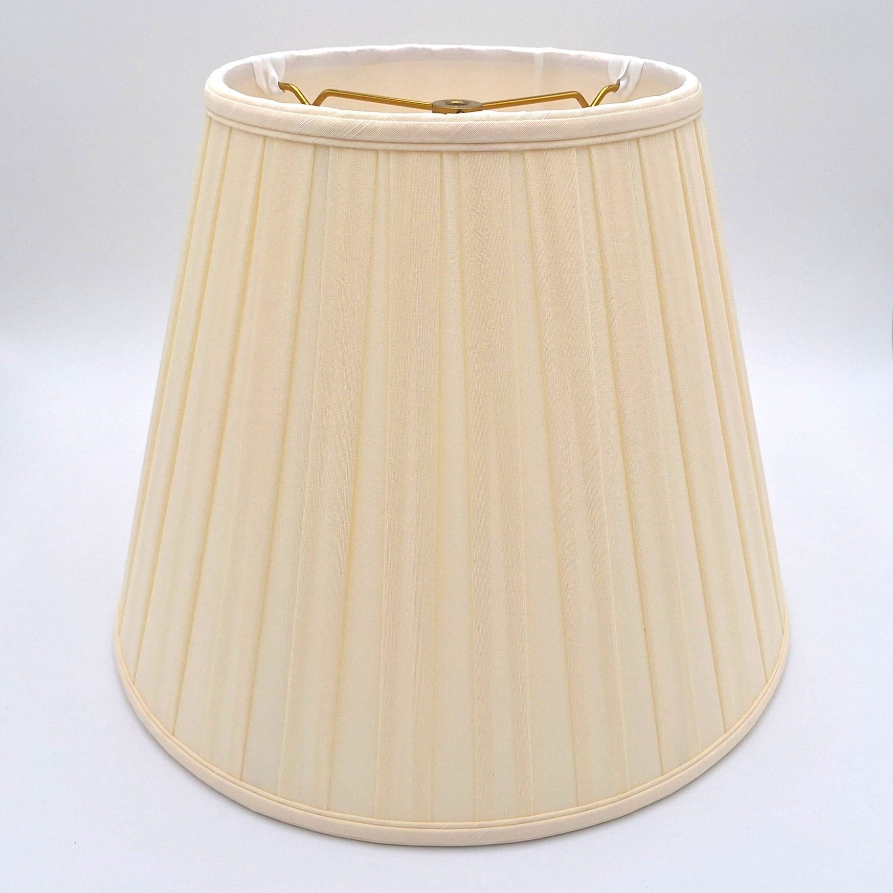 An eggshell shantung space box pleat empire lampshade with hand-pleated fabric and translucent finish, shown against a plain white background.
