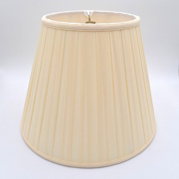 An eggshell shantung space box pleat empire lampshade shown at a slight angle, highlighting the distinctive spaced pleat pattern.