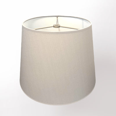 The Linen British Empire Evergreen Fog is a simple, cylindrical lampshade in solid evergreen fabric, slightly wider at the bottom with a visible metal frame on top, shown against a plain white background.
