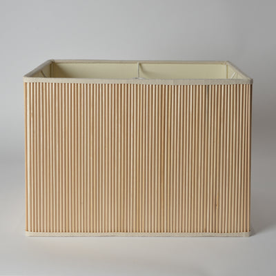 The Stick Box Rectangle is a modern storage box with vertical light wood slats and a cream interior, shown on a white background—perfect for stylish, handcrafted organization.